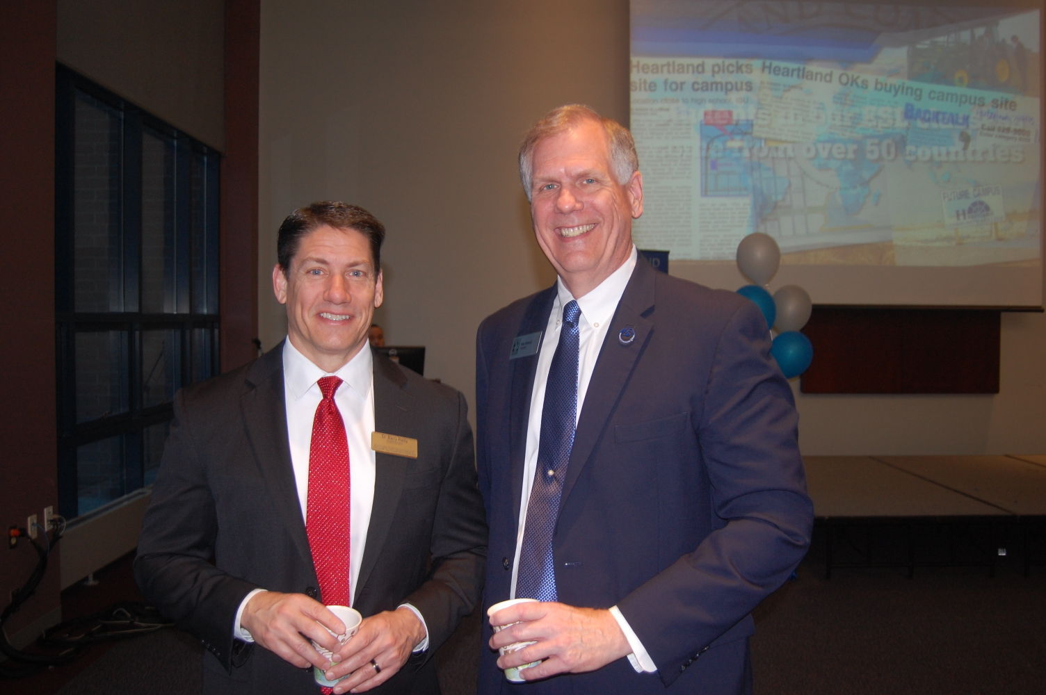 Dr. Barry Reilly, Heartland Community College President Robert Widmer